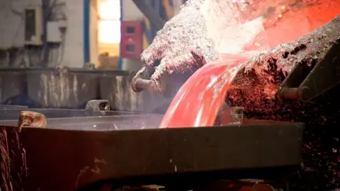 Molten aluminium is poured into a mould at the Fort William power plant