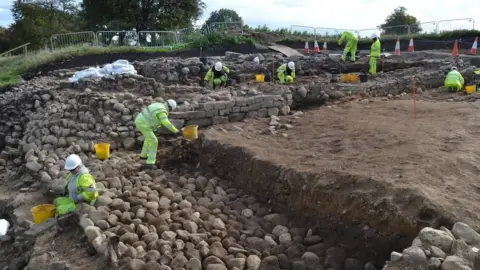 Dr Jonathan Shipley Archaeologists excavate