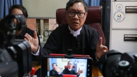 Google Khin Maung Zaw (R) and Min Min Soe (L), lawyers representing detained Myanmar leader Aung San Suu Kyi, address members of the media at Khin Maung Zaw's house in Naypyidaw on May 24, 2021, as Suu Kyi made her first in-person court appearance since the military coup in February.