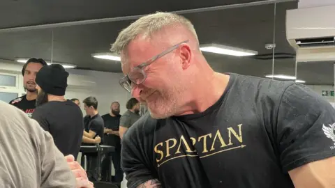 Sam Read/BBC Mark Waldon arm wrestling at Milton Keynes Arm Wrestling Club