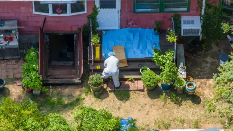 Getty Images Police search Rex Heuermann's home