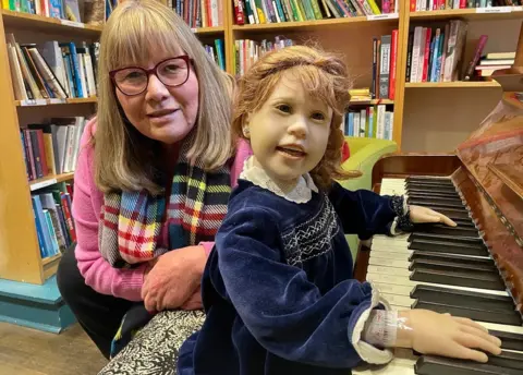 BBC Simone Varga with Annabelle the doll