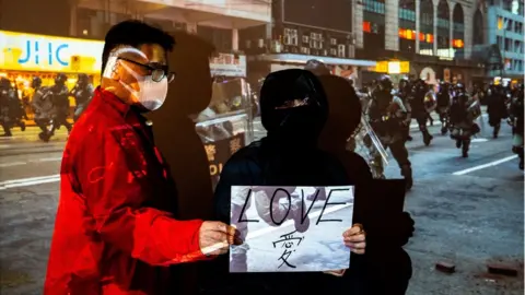 BBC Father Mr Tsang and his daughter Alice, the protester