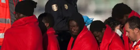 Getty Images Migrants are brought to shore in Málaga after a coastguard rescue in March 2017