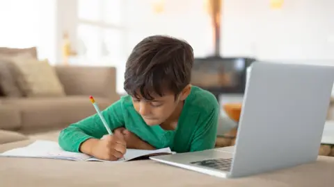 Getty Images Boy working at home