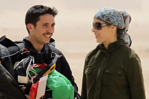 KHALIL MAZRAAWI Jordanian Prince Hamzah bin al-Hussei, president of the Royal Aero Sports Club of Jordan, and his wife Princess Basma attend a media event to announce the launch of "Skydive Jordan", in the Wadi Rum desert on April 19, 2011