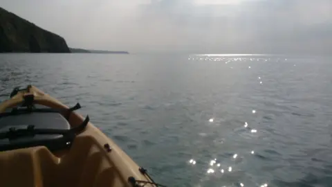 Cynan Jones Jones's kayak on the water off Aberaeron