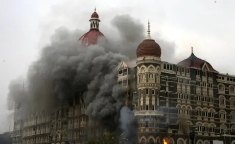 Getty Images Smoke and flames billow out from The Taj Mahal hotel in Mumbai on November 29, 2008.