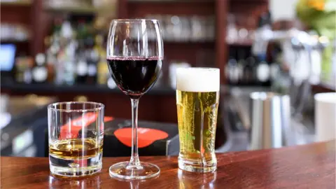 Getty Images Whisky, wine and beer on a bar