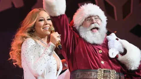 Getty Images Mariah Carey with Santa