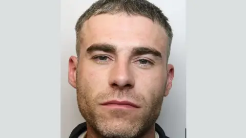 Wiltshire Police Ricky Lee Langford looking at the camera for his custody image