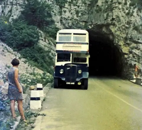 1968 CRD253 Group Wendy Scott standing by the side of the E27 north of Pec (Peja), now in Kosovo.