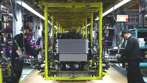 Getty Images Manufacturing workers