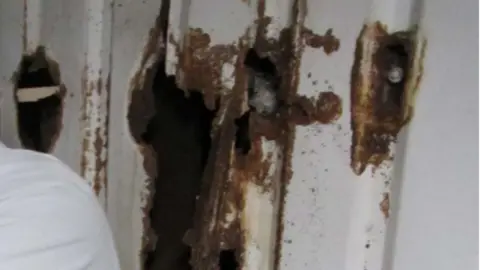 Environment Agency Rusty hole in one wall