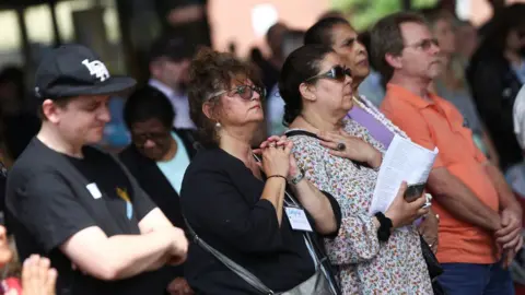 Reuters People attend a service at a church near the Grenfell Tower in North Kensington