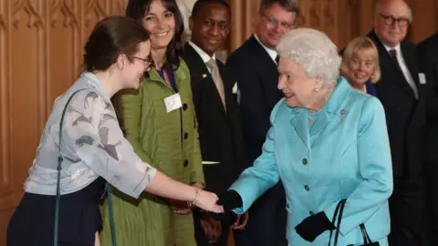 PA Media The Queen meets volunteers at a reception to mark the centenary of the National Council for Voluntary Organisations (NCVO)