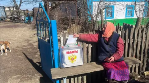 Russian-controlled Kherson election commission A woman votes in Kherson region