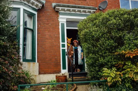 Ellie Grace Photography Doorstep portrait of Nick, Emily and Stitch in Sharrow Vale