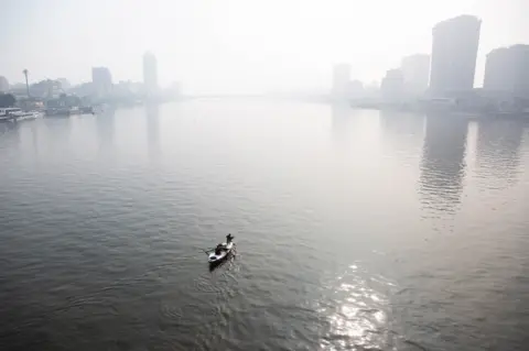 Islam Safwat/Getty A fishing boat on the River Nile in Giza, Egypt, on Monday, Dec. 4, 2023. The International Monetary Fund said Egypt's battle against record consumer-price growth is its first focus, potentially easing pressure on authorities to imminently enact a much-anticipated currency devaluation