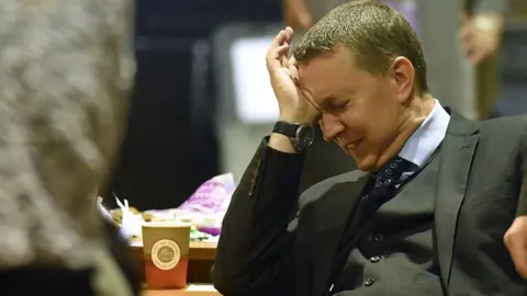 Getty Images An official reacts as vote counters wait for Ballot boxes to arrive at the Peter Paine Performance Centre where the vote count for the constituency of Boston and Skegness is underway following voting in today's General Election on June 8, 2017 in Boston, England.