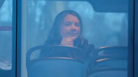 Reuters Greta Thunberg gives a thumbs up gesture as she is pictured on a bus