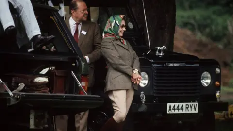 Getty Images Queen pictured next to her Land Rover