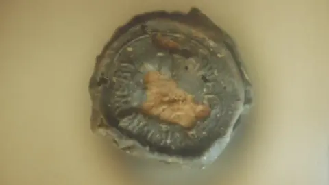 Tennent's Bottle top from stout that sank in The Light of The Age