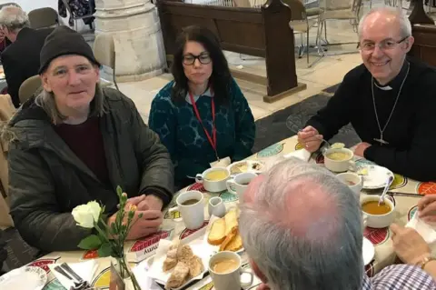 BBC The Archbishop of Canterbury sat down to eat with some staff and users of the church