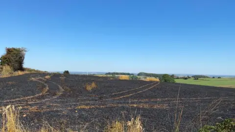 Derbyshire Fire Service A burnt field in Shottle