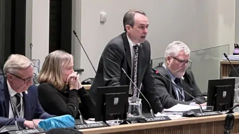 Simon Dedman/BBC Mark Coxshall at a Thurrock Council meeting