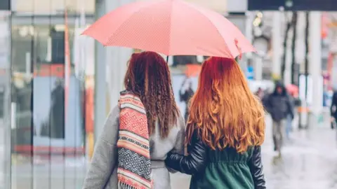 Getty Images Shoppers in the rain