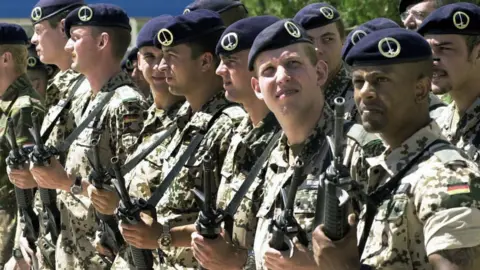 Getty Images Soldiers standing next to eachother on parade