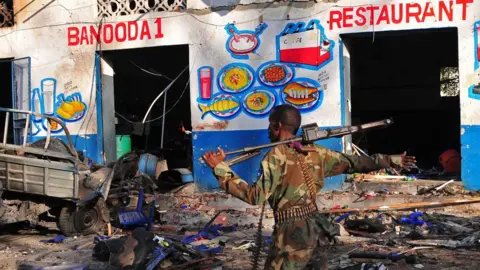 AFP/Getty Images Scene of car bomb destruction