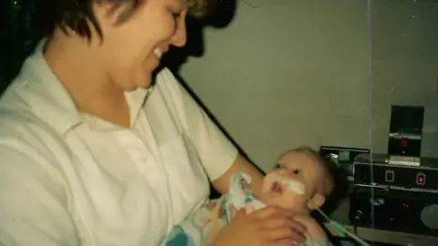 Crowter family Liz with Heidi as a baby