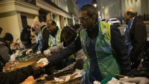 Getty Images Food being distributed in Charing Cross to homeless people