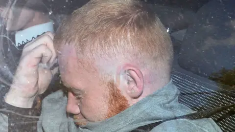 PACEMAKER Andrew Martin appears at Lisburn Court in a car