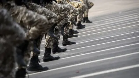 AFP File photo showing members of the Saudi security forces march during a military parade in Mecca on 17 September 2015