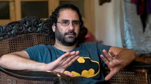 AFP File photo from 17 May 2019 showing Alaa Abdel Fattah at his home in Cairo, Egypt