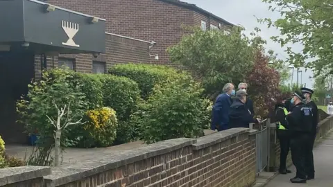 Essex Police Police officers outside Chigwell and Hainault Synagogue