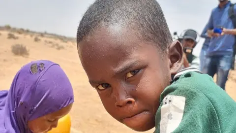 Boy staring into the camera