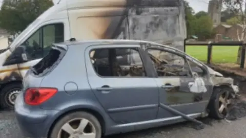 Devon and Cornwall Police Burned out car and van