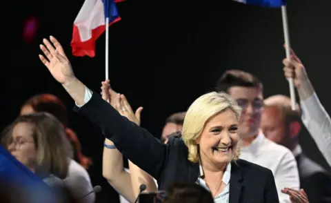 Getty Images French far-right Rassemblement National (RN) party presidential candidate Marine Le Pen greets to her supporters in Arras on 21 April