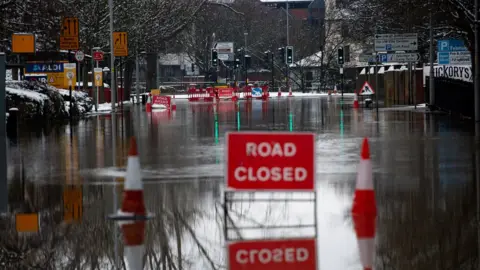 PA Media Flood water remains around Tybridge Street in Worcester after overnight snow showers. Picture date: Sunday January 24, 2021.