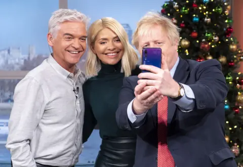 Ken McKay / ITV / Shutterstock Phillip Schofield, Holly Willoughby and Boris Johnson take a selfie together