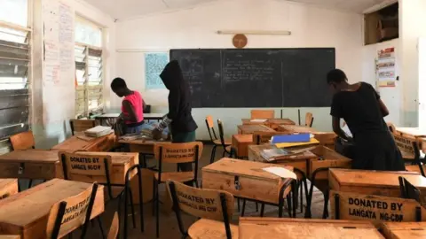 AFP School children pack their books to take home, following a directive by the Kenyan government to suspended learning in all institutions of learning as a preventive measure against the spreading of the COVID-19 coronavirus, on March 16, 2020, in Nairobi