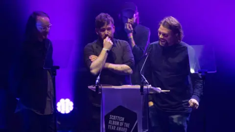 Getty Images Grant Hutchinson of Frightened Rabbit receives the Modern Scottish Classic Award for "The Midnight Organ Fight" album during the Scottish Album Of The Year Award Ceremony