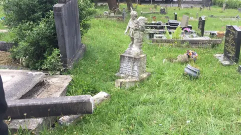 Louise Carpanini the damage to graves at Maesteg cemetery
