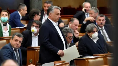 Reuters Mr Orban appeared in parliament on 20 March ahead of the vote the government special powers