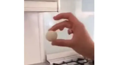 YouTube Photo of a hand holding a ball of rice