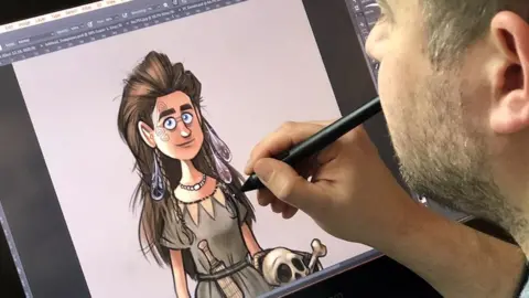 Artist Alex Leonard working on one of the characters